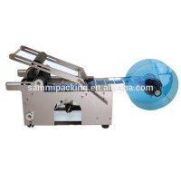 Easy to operate MT-50 semi-automatic small round PET bottle labeling machine